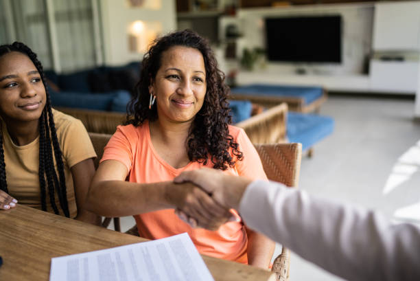 istock Professional consultant handshake with customer during a home visit 1397417831