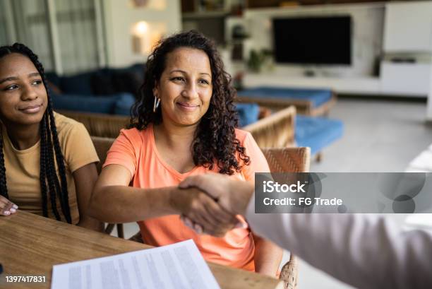 Professional Consultant Handshake With Customer During A Home Visit Stock Photo - Download Image Now