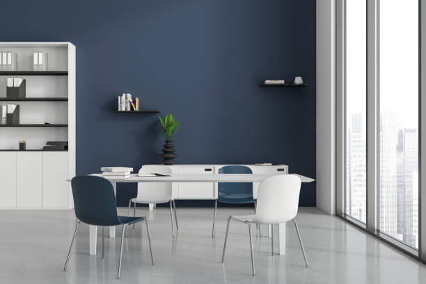 istock Light meeting room interior with table and seats, shelf and window 1397418611