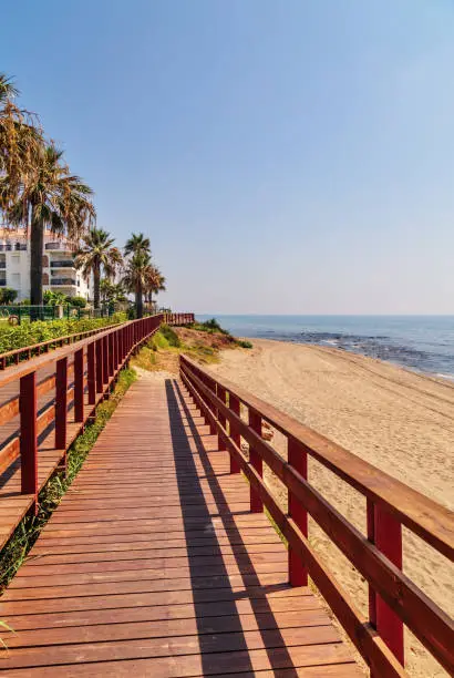 Wooden path on the beach. Mijas Costa. Andalusia. Spain