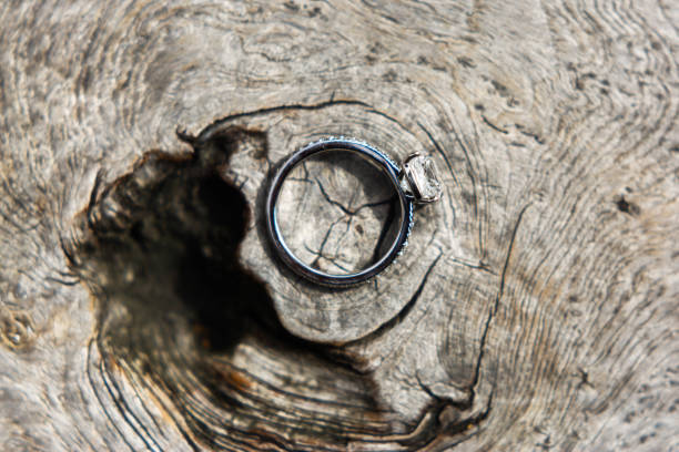 istock Wedding ring on a wooden background 1397419769