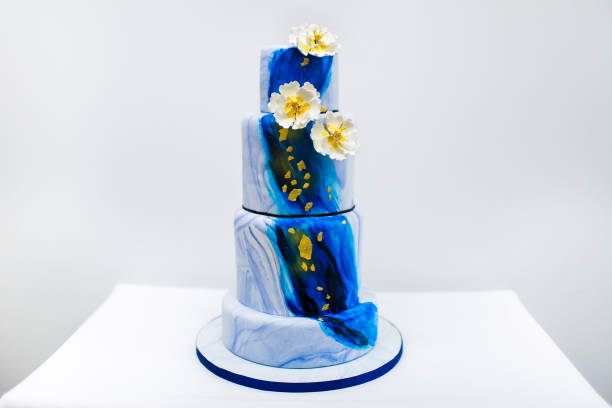 istock Multilevel blue wedding cake with flowers 1397419785