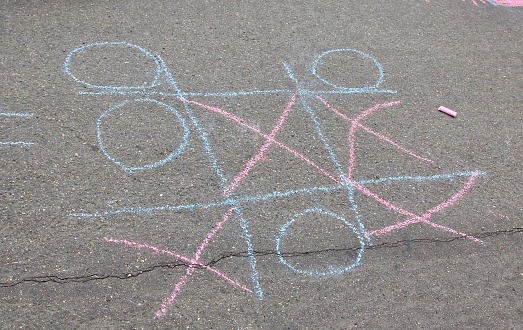 Kid's Tic Tac Toe in chalk with no winner