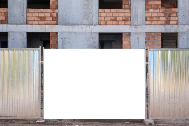 istock Blank white banner for advertisement mounted on the hoardin of construction site 1397420698