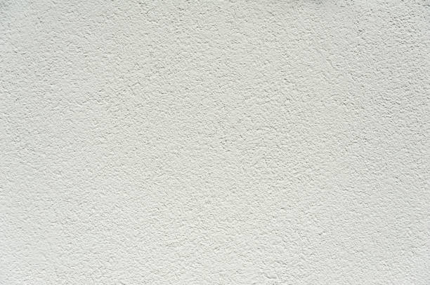 surface d’un mur blanc robuste - plaster white textured wall photos et images de collection