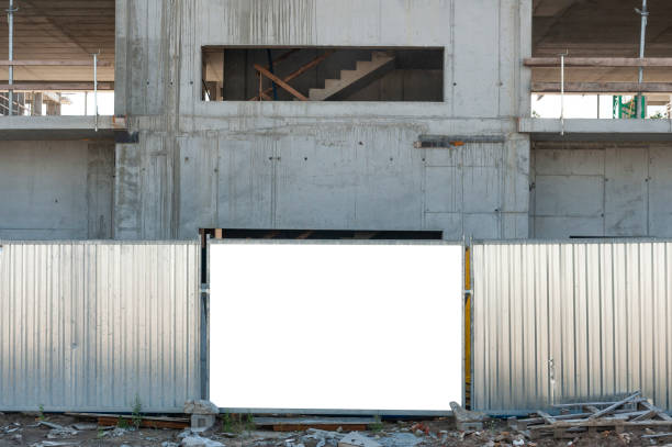 istock Blank white banner for advertisement mounted on the hoardin of construction site 1397420772