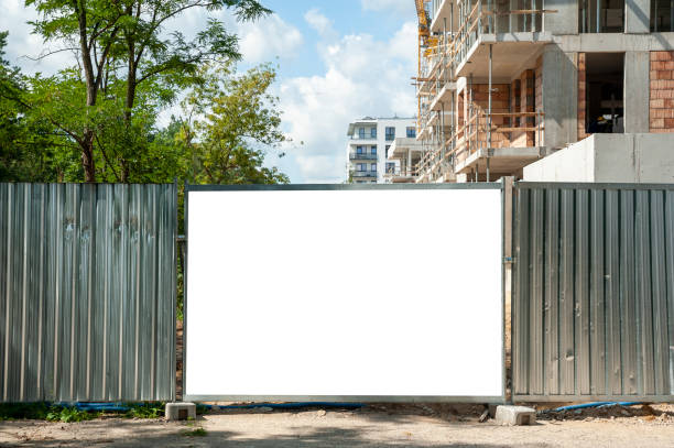 istock Blank white banner for advertisement mounted on the hoardin of construction site 1397420776