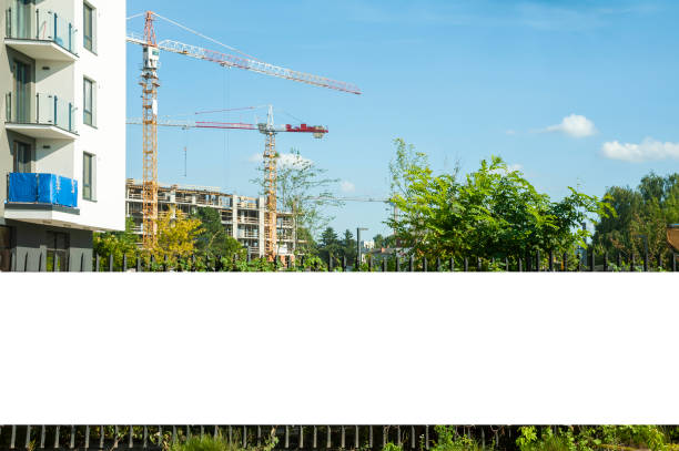 istock Blank white banner for advertisement mounted on the hoardin of construction site 1397421436
