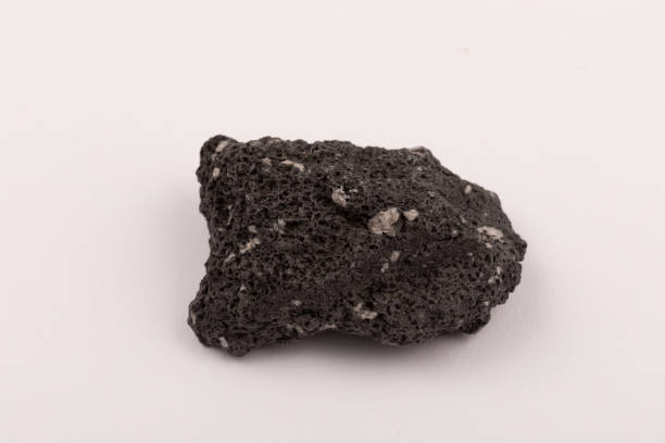 istock Volcanic Basalt lava rock sample with zeolites 1397421736