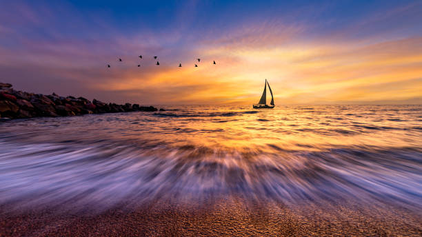 istock Sunset Sailboat Ocean Landscape Sailing Birds 1397422696