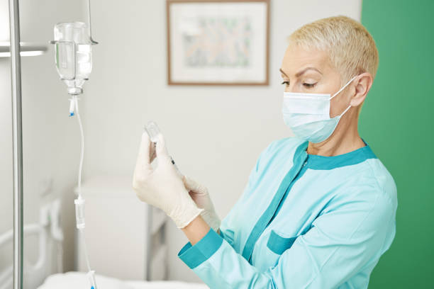 istock Woman physician is taking medication from vial 1397422815
