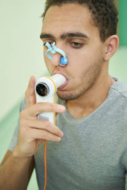 istock Person taking lung finctionality test with spirometry device 1397422852