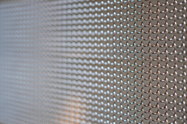 istock tight patterned metal grid fence in perspective angle 1397427083
