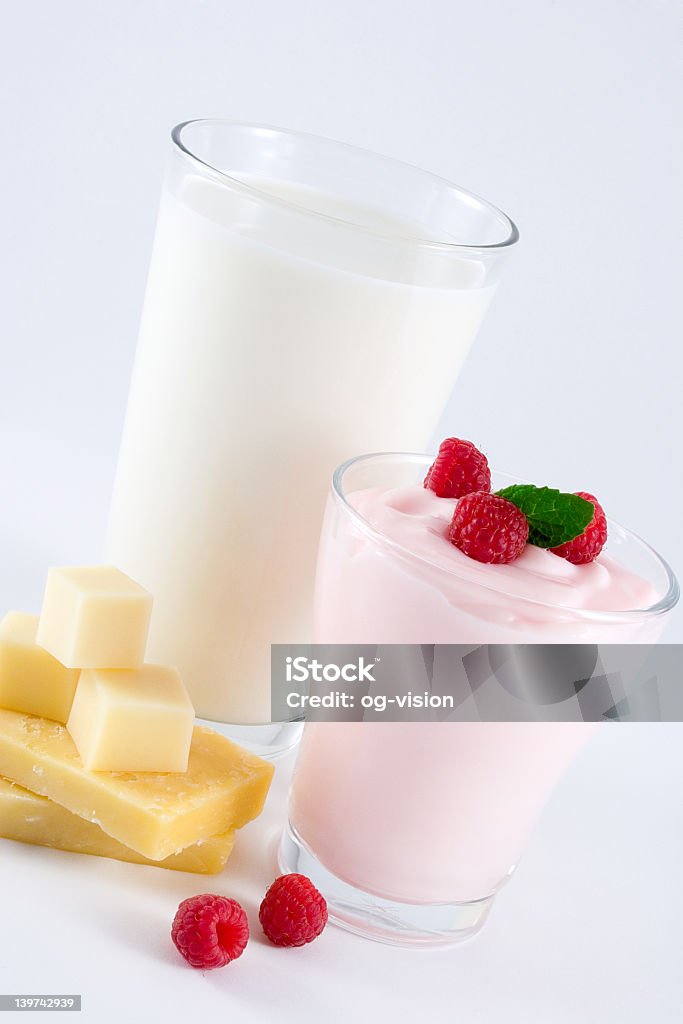 A photo showing some dairy products Dairy products: milk, yogurt, cheese. Cheddar Cheese Stock Photo