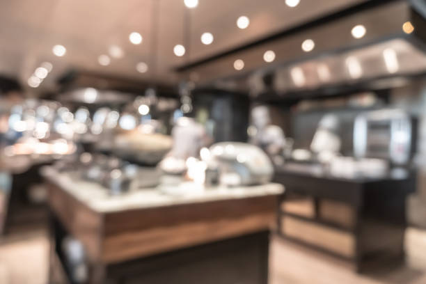 istock Buffet at hotel restaurant interior blur background with blurry open kitchen counter bar of food catering service business with chef staff cooking for breakfast, lunch or dinner meal 1397437391