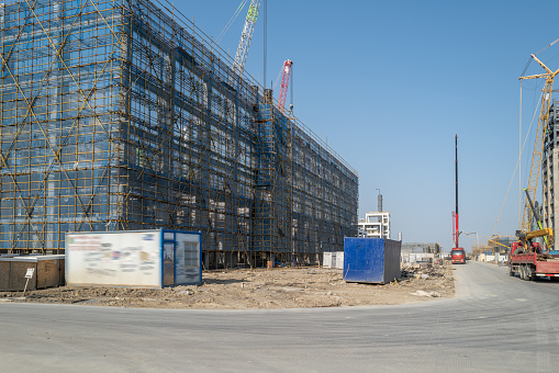 A multi storey building construction site in outer area of city
