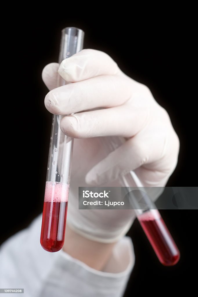 Medical worker holding blood samples Medical worker holding blood Analyzing Stock Photo