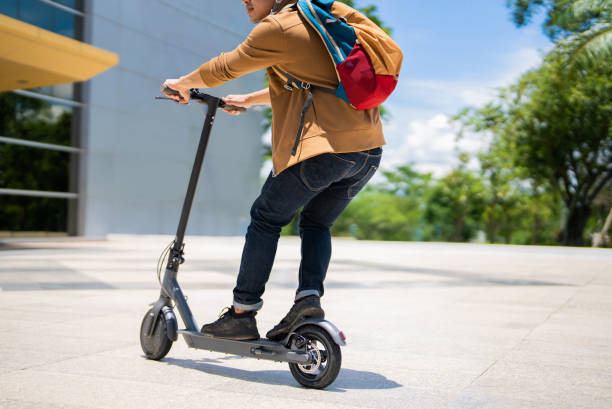 istock An Asian man rides an electric scooter to work. 1397442297