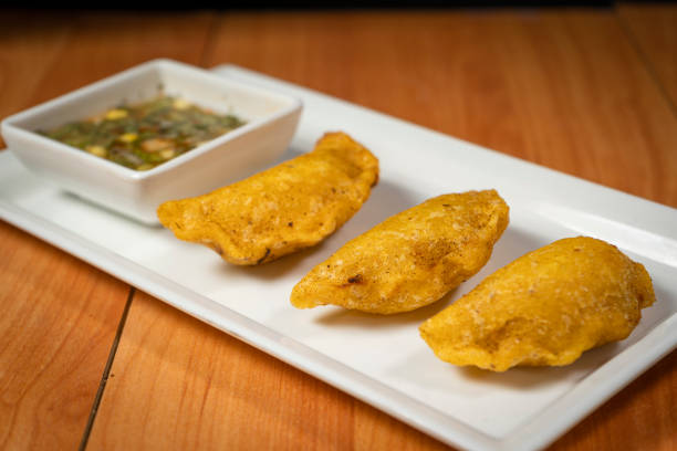 istock Colombian empanada with spicy sauce 1397448784