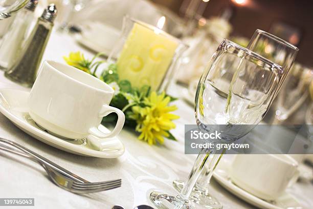 A Formal Dinner Setting With Yellow Flowers Stock Photo - Download Image Now - Buffet, Crockery, Cup