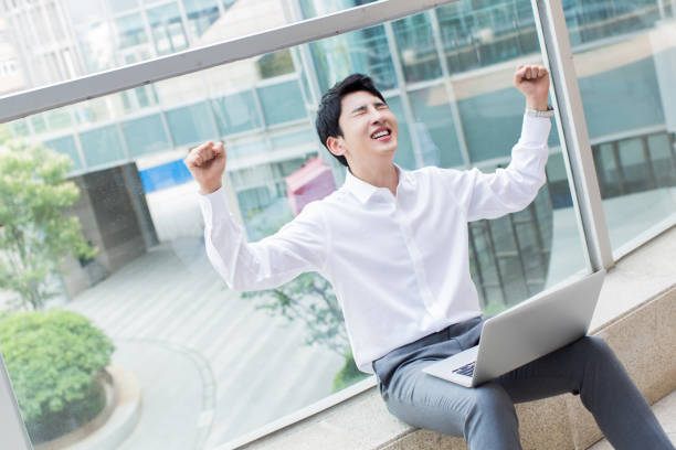 young chinese salesman stock photo