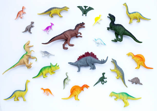 istock Plastic dinosaur toys on white background. Top view 1397453740