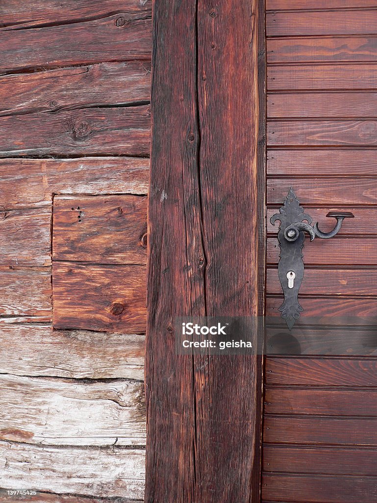 wooden door with beautiful handle log cabin door in Zinal, Switzerland Accessibility Stock Photo