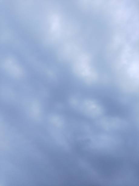 istock Turquoise blue clouds visible in the summer sky 1397454862