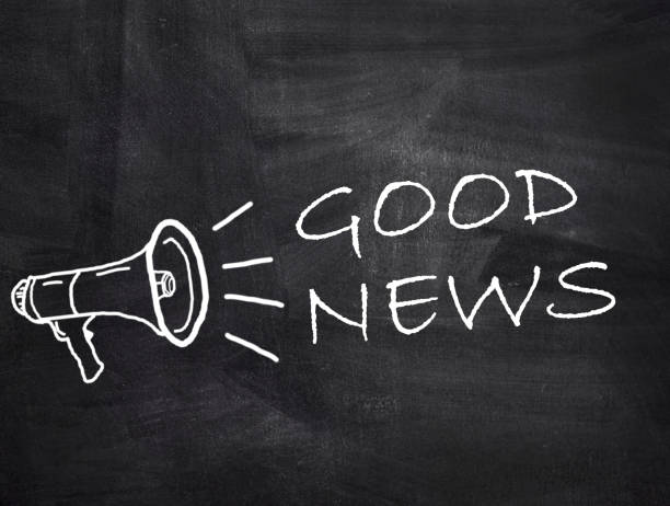 istock Good News text with megaphone on chalkboard background. 1397455276