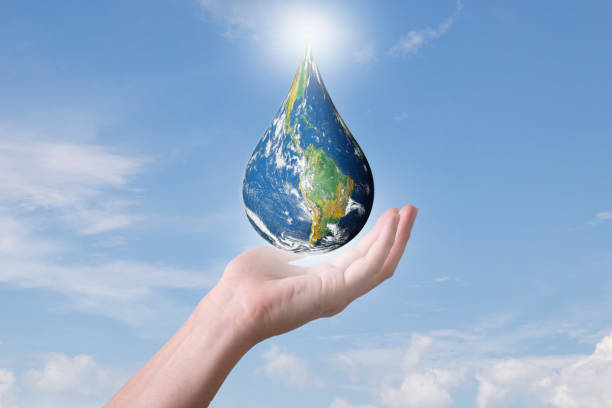 Earth globe drop shape floating in hands , Blue world globe in human hand on cloudy sky background, Energy saving , world environment day concept, Elements of this image furnished by NASA stock photo