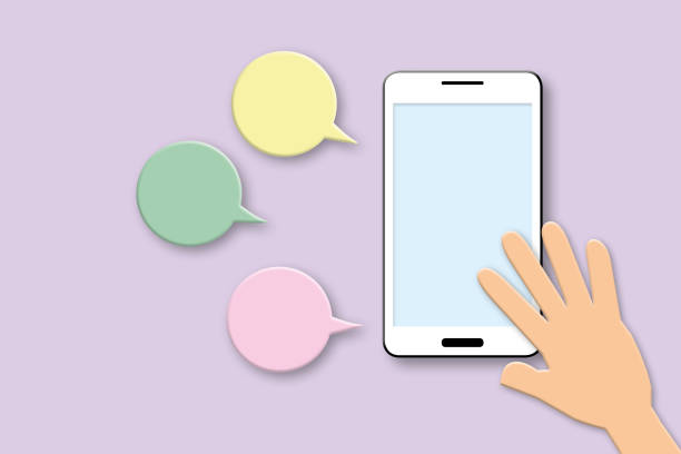 istock Hand with smartphone and colourful speech bubble on pastel purple background. Mockup mobile phone and technology concept. 1397458146