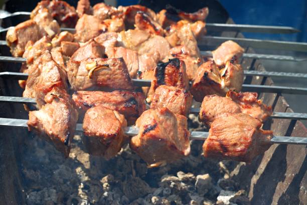 istock Delicious juicy kebabs are prepared on the grill. 1397458848