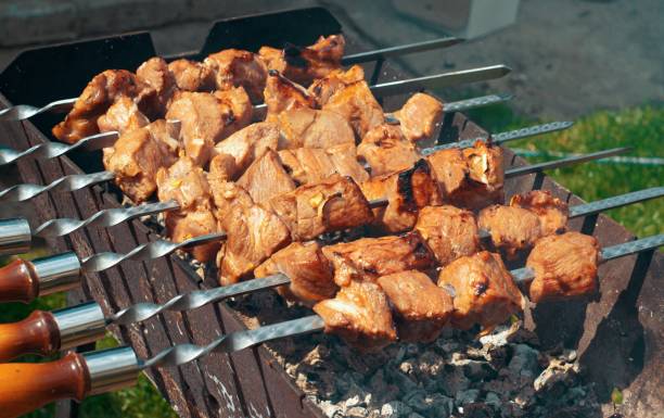 istock Delicious juicy kebabs are prepared on the grill. 1397458849