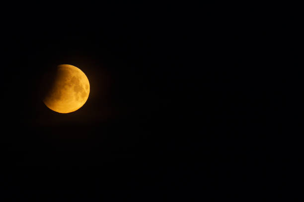 istock Full moon and the beginning of a lunar elipse 1397459657