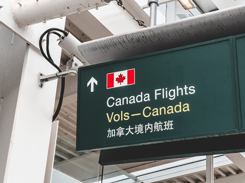 Vancouver, Canada - January 15,2022: View of directional sign Canada Flights inside Vancouver International Airport(YVR)