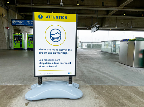 Vancouver,Canada - January 15,2022: View of sign Face Covering are mandatory at Vancouver International Airport