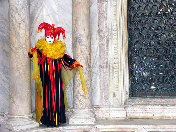 Venice Carnival: mask between pillars 2 stock photo