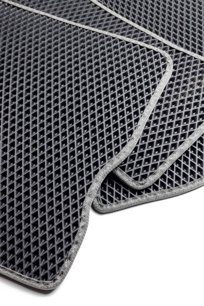 istock stack of eva ethylene vinyl acetate car floor mats. waterproof honeycombs textured carpet. 1397464564