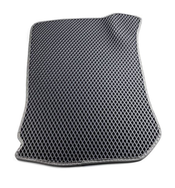 istock new ethylene vinyl acetate car floor mat isolated on white background. honeycombs texture. black material with silver border. car floor water protection. eva car mats cut out 1397464576