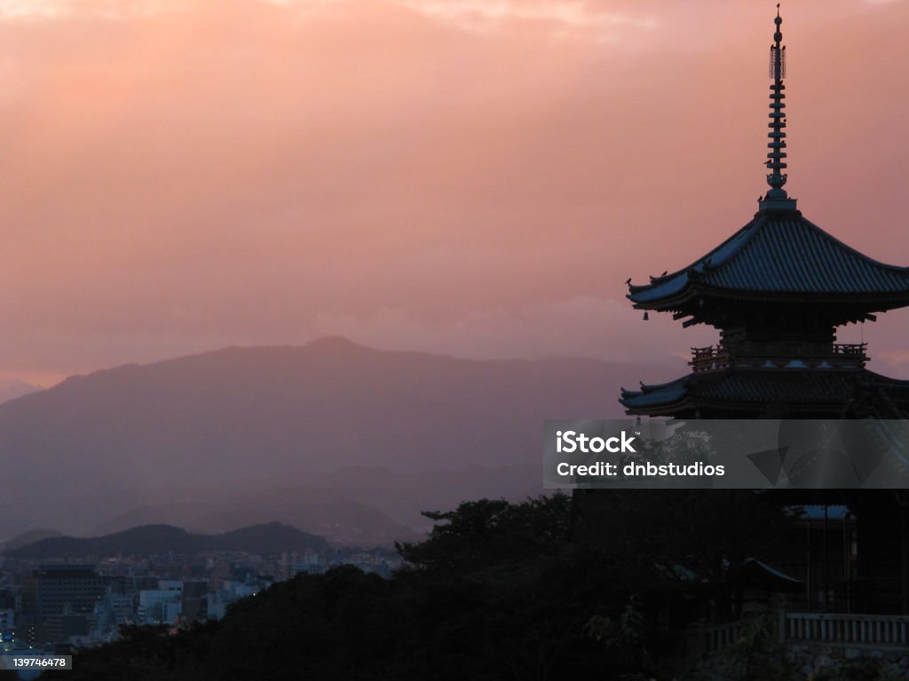 Kyoto palace at sunset This is a beautiful palace in Kyoto, Japan at sunset with the mountains and city in the background. Kyoto City Stock Photo