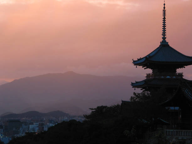 Kyoto palace at sunset This is a beautiful palace in Kyoto, Japan at sunset with the mountains and city in the background. kyoto prefecture photos stock pictures, royalty-free photos & images