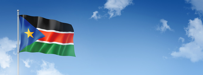 South Sudan flag, three dimensional render, isolated on a blue sky. Horizontal banner. 3D illustration