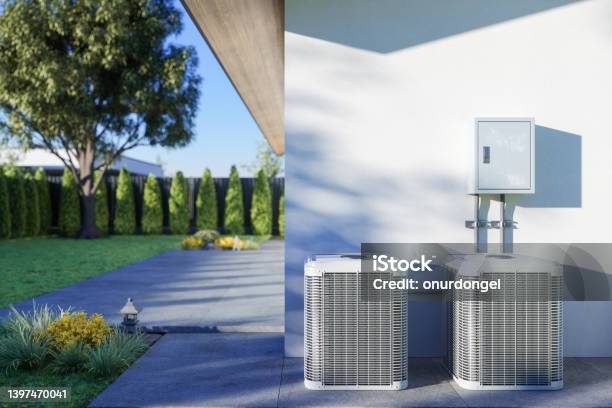 Closeup View Of Air Conditioning Outdoor Units In The Backyard Stock Photo - Download Image Now