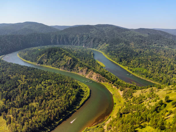 istock Awesome view of scenic river among evergreen woods 1397471123