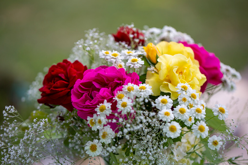 Colorful flower bouquet with roses and daisies