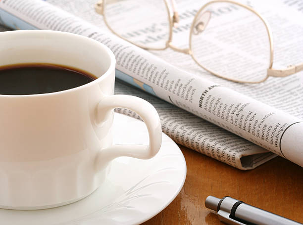 istock coffee, ballpen,glasses and newspaper 139747418