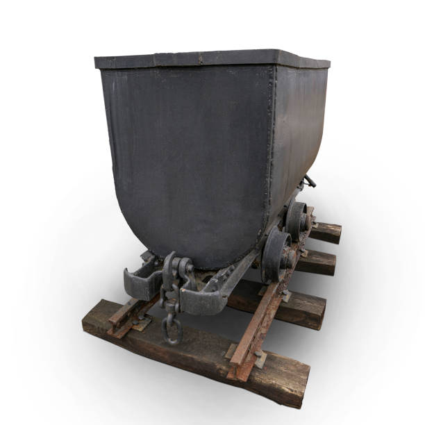 Old iron mine trolleys for coal on rusty rails isolated on white background
