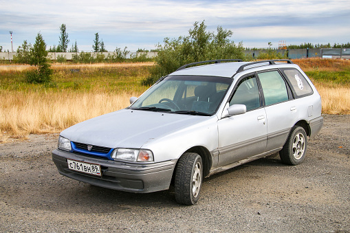 Novyy Urengoy, Russia - August 6, 2016: Compact urban estate car Nissan Wingroad in a city street.