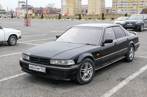 Anapa, Russia - November 29, 2014: Black saloon car Honda Accord Inspire in a city street.