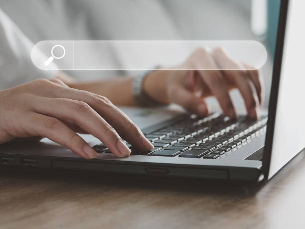 istock Searching through the Search icon on the tablet screen. The icon is illuminated. 1397475305